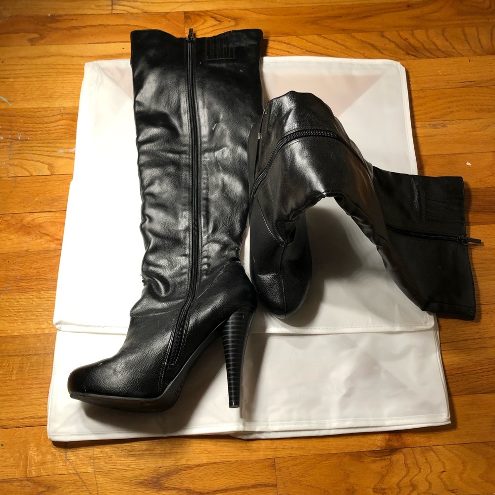 Knee high faux leather heeled boots.